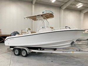 Edgewater 208CC 2025 Edgewater 208CC boat on trailer in indoor showroom.