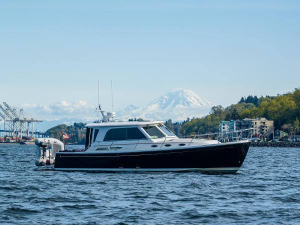 Back Cove 37 2013 Back Cove 37 yacht on water with scenic mountain backdrop.