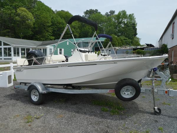 Boston Whaler 170 Montauk 2025 Boston Whaler 170 Montauk boat on trailer, parked outdoors.