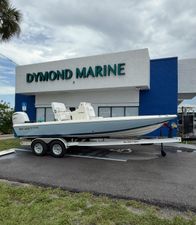 Skeeter SX221 2025 Skeeter SX221 boat on trailer outside Dymond Marine dealership.