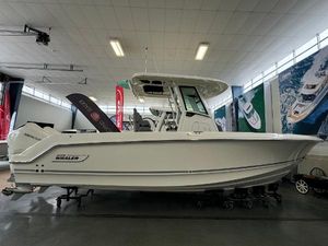 Boston Whaler 250 Outrage 2025 Boston Whaler 250 Outrage boat displayed in a showroom.