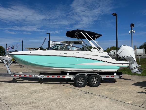 Monterey M-45 2025 Monterey M-45 boat on trailer, turquoise hull, outdoor display.