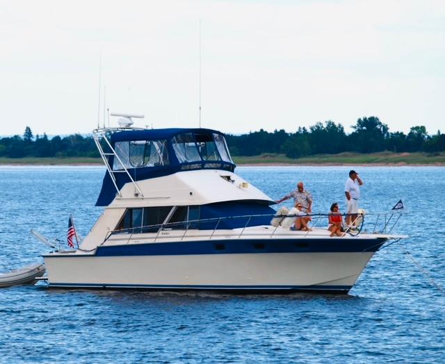 Silverton 40 Convertible 1988 Silverton 40 Convertible yacht on calm water with people enjoying the view.