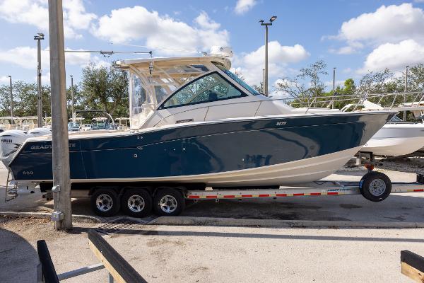 Grady-White Express 330 2019 Grady-White Express 330 boat on trailer under blue sky.