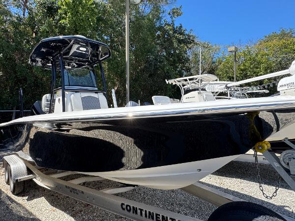 Tidewater 2500 Carolina Bay 2020 Tidewater 2500 Carolina Bay boat on trailer, black hull, parked outdoors.