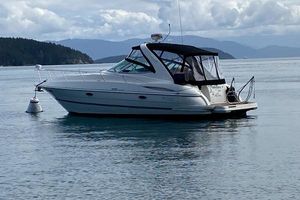 Cruisers Yachts 340 Express 2007 Cruisers Yachts 340 Express boat on calm water with scenic mountain backdrop.