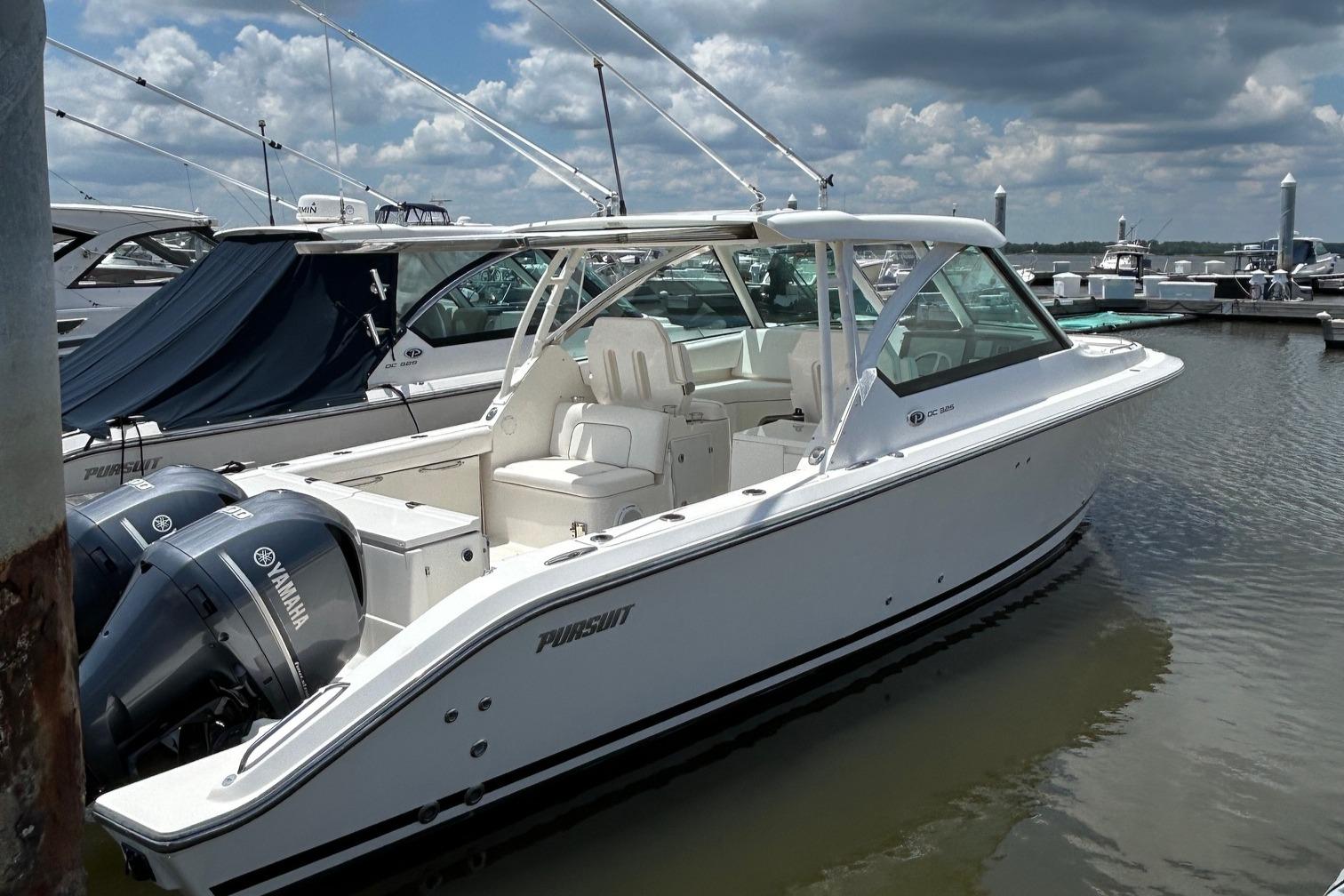 Pursuit DC 325 Dual Console 2015 Pursuit DC 325 Dual Console boat docked with Yamaha engines.