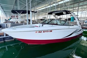 Regal LS4 Surf 2020 Regal LS4 Surf boat docked in marina, white and red design.