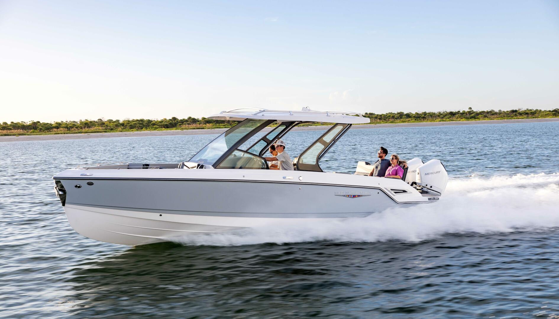 Monterey 30 ELITE 2025 Monterey 30 ELITE boat cruising on open water with passengers.