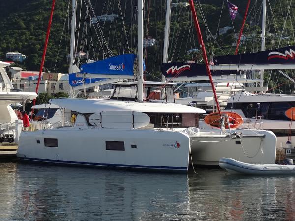 Lagoon 42 2020 Lagoon 42 catamaran docked at a marina with surrounding boats.