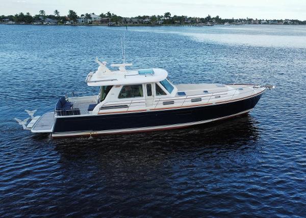 Sabre 48 Salon Express 2013 Sabre 48 Salon Express yacht on calm water, side view.