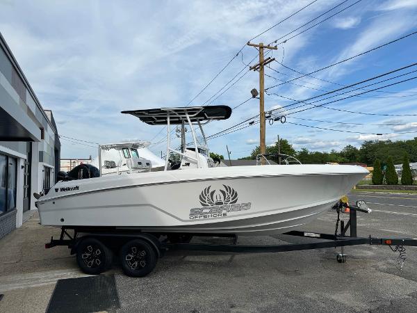 Wellcraft 202 Fisherman 2025 Wellcraft 202 Fisherman boat on a trailer, parked outdoors.