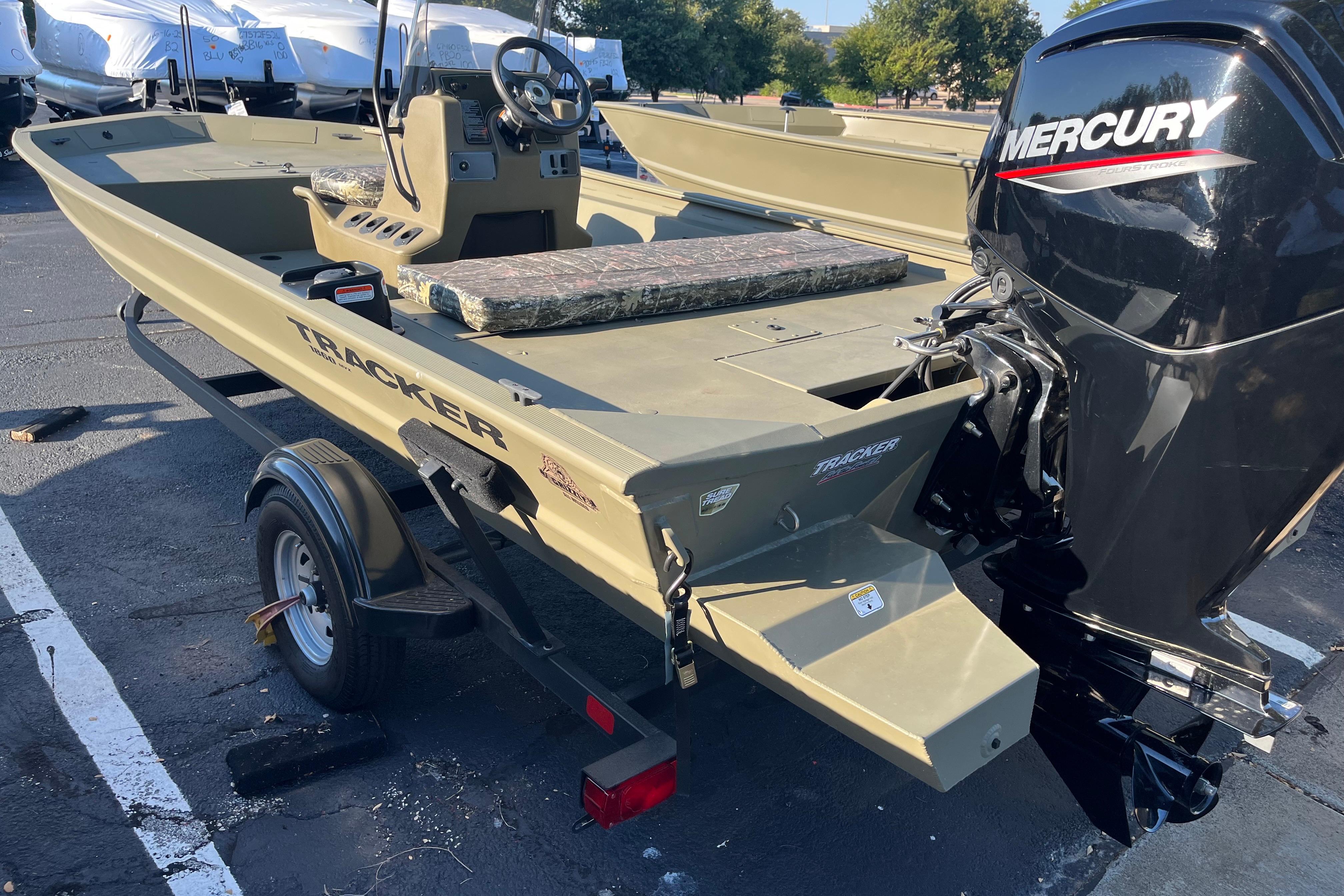 Tracker Grizzly 1860 CC 2025 Tracker Grizzly 1860 CC boat with Mercury engine on trailer.