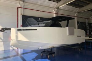 De Antonio Yachts D28 Open 2020 De Antonio Yachts D 28 OPEN in showroom, sleek white design.