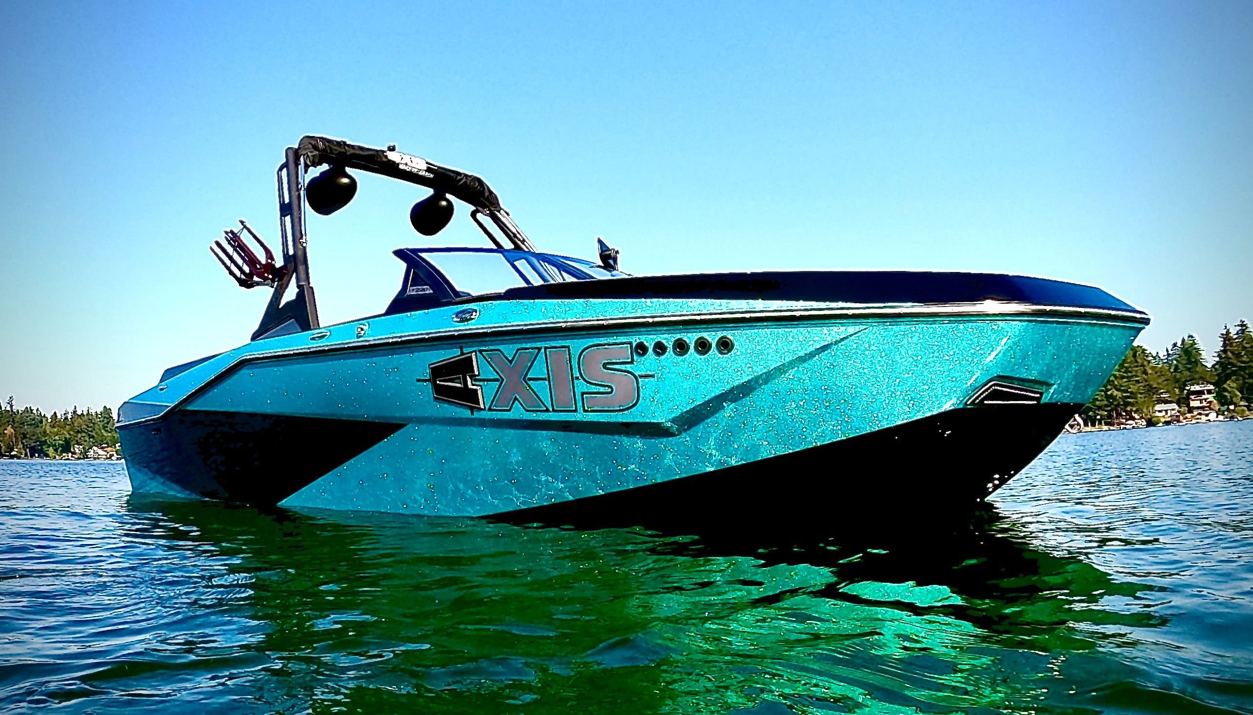 Axis T220 2022 Axis T220 boat on water, vibrant blue, sleek design, sunny day.