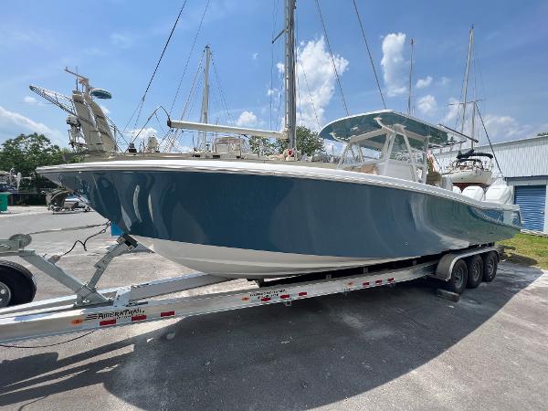 Invincible 36 Open Fisherman 2022 Invincible 36 Open Fisherman boat on trailer, docked at marina.