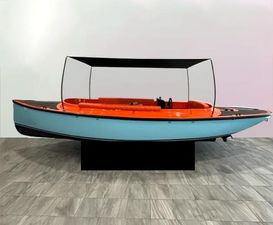 Vision Marine Technologies Fantail 217 2023 Vision Marine Technologies Fantail 217 boat with orange and blue design, displayed indoors.