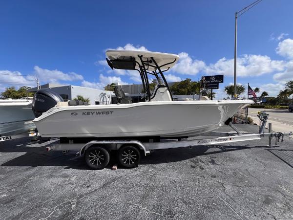 Key West 239 FS 2025 Key West 239 FS boat on trailer, parked outdoors under clear blue sky.