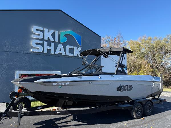 Axis A24 2021 Axis A24 boat on trailer outside Ski Shack building.