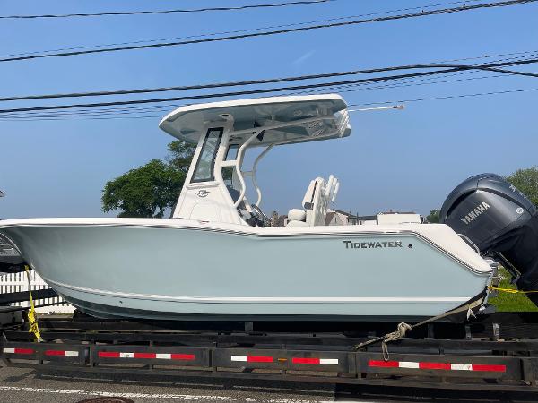 Tidewater 232 LXF 2025 Tidewater 232 LXF boat on trailer, featuring Yamaha engine, side view.