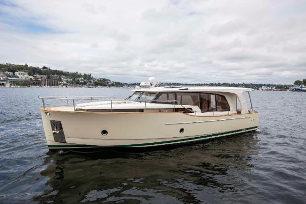 Greenline 40 Hybrid Diesel/Electric Yacht 2017 Greenline 40 Hybrid Diesel/Electric Yacht cruising on a calm lake.