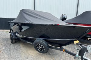 Lund 1775 Adventure Sport 2025 Lund 1775 Adventure Sport boat with cover on trailer, parked outdoors.