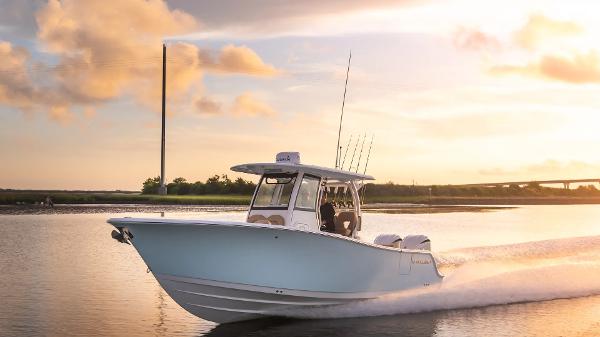 Sportsman Open 282 Center Console 2025 Sportsman Open 282 Center Console boat cruising at sunset on calm water.