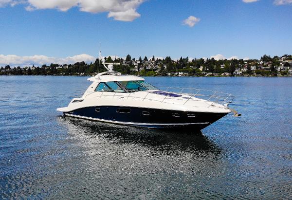 Sea Ray 450 Sundancer 2011 Sea Ray 450 Sundancer yacht on calm water under blue sky.