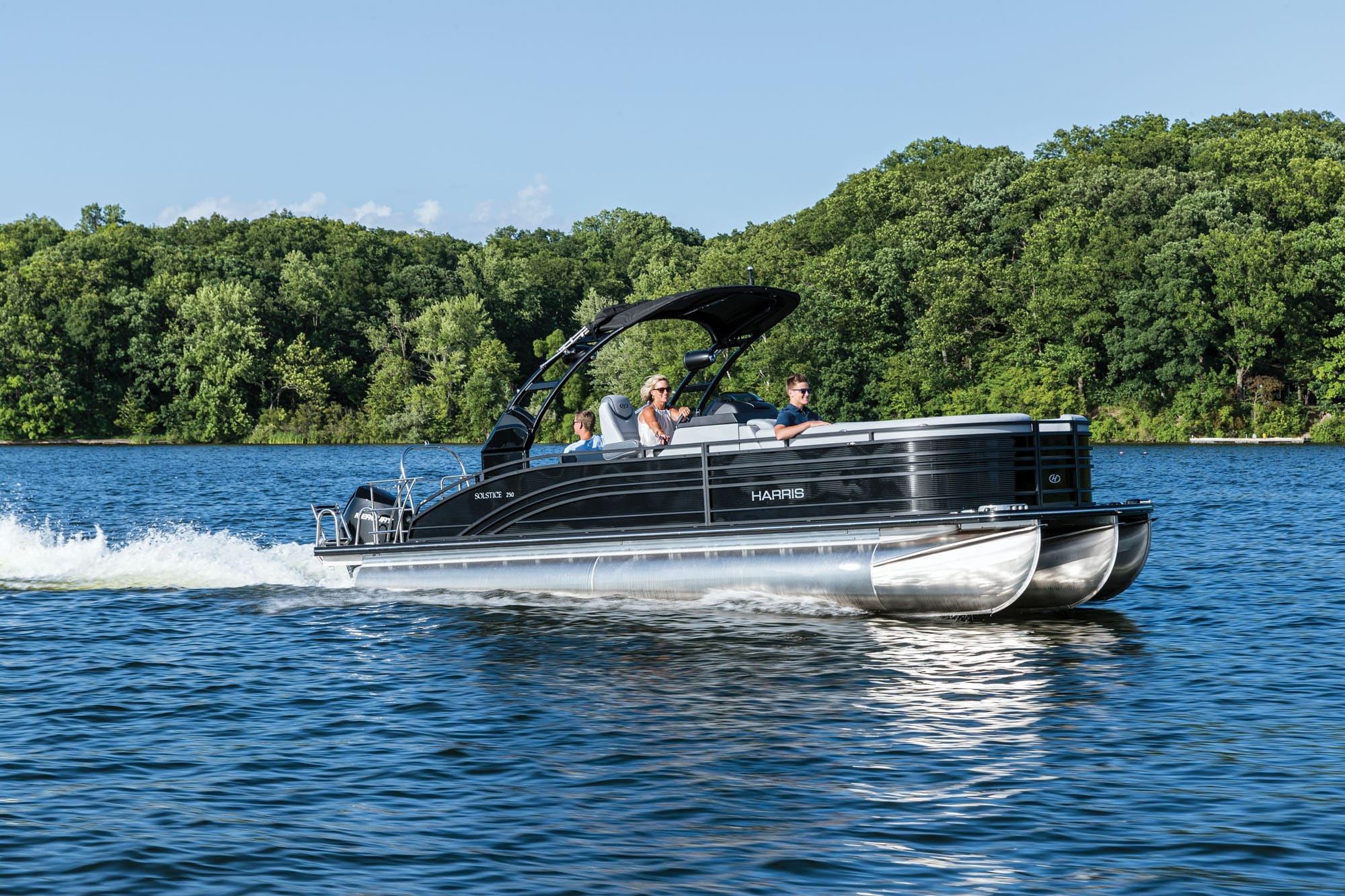 Harris FloteBote Solstice 250 SL 2020 Harris FloteBote Solstice 250 SL pontoon boat cruising on a scenic lake.