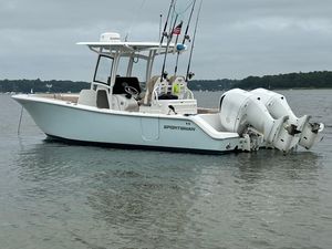 Sportsman Open 282 Center Console 2019 Sportsman 282 boat with dual engines on calm water.