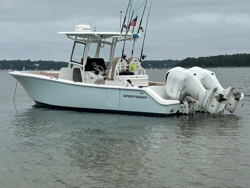 Sportsman 282 2019 Sportsman 282 boat with dual engines on calm water.
