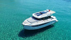 Custom custom Modern 2024 custom boat on clear turquoise water, showcasing sleek design and advanced features.
