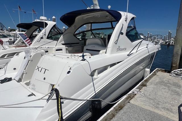 Sea Ray 38 Sundancer 2007 Sea Ray 38 Sundancer yacht docked at marina under clear blue sky.
