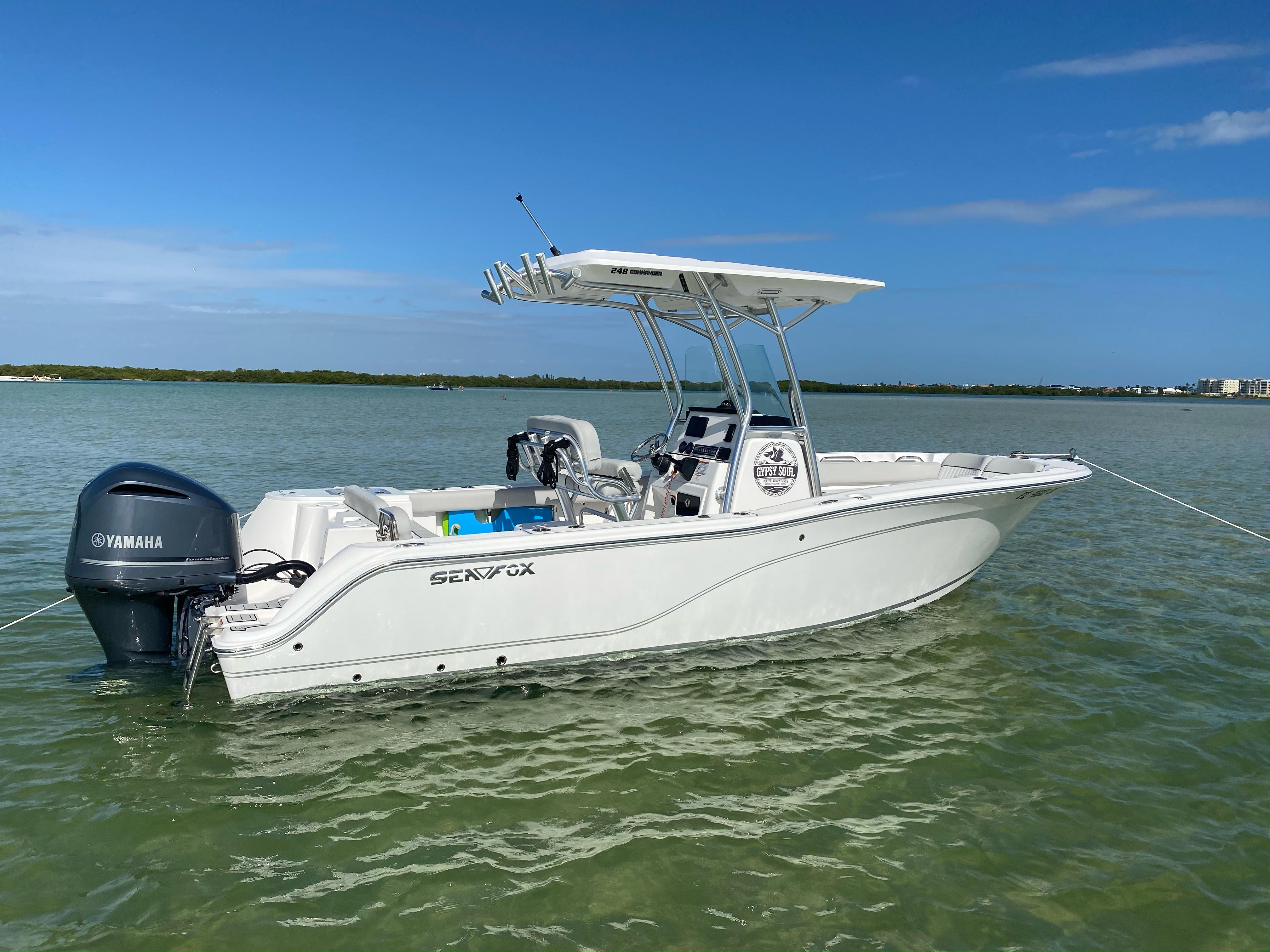Sea Fox 248 Commander 2020 Sea Fox 248 Commander boat anchored on calm water with Yamaha engine.