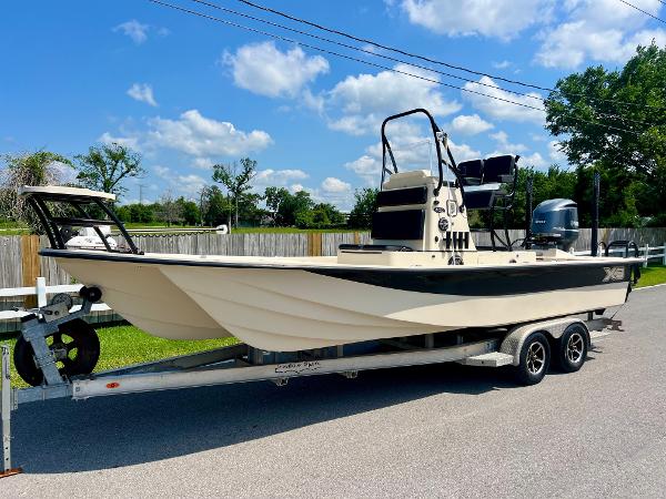 Shallow Sport 25 X3 2018 Shallow Sport 25 X3 boat on trailer under blue sky.