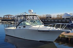 Albemarle 268 Express Fisherman 2006 Albemarle 268 Express Fisherman boat docked in a marina under clear blue skies.