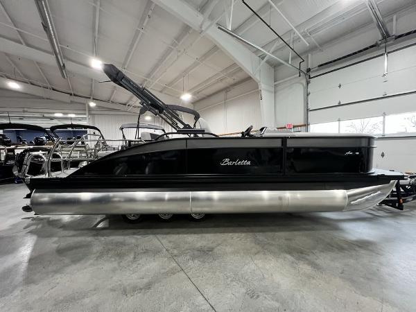 Barletta A22UC 2025 Barletta A22UC pontoon boat in showroom, side view.