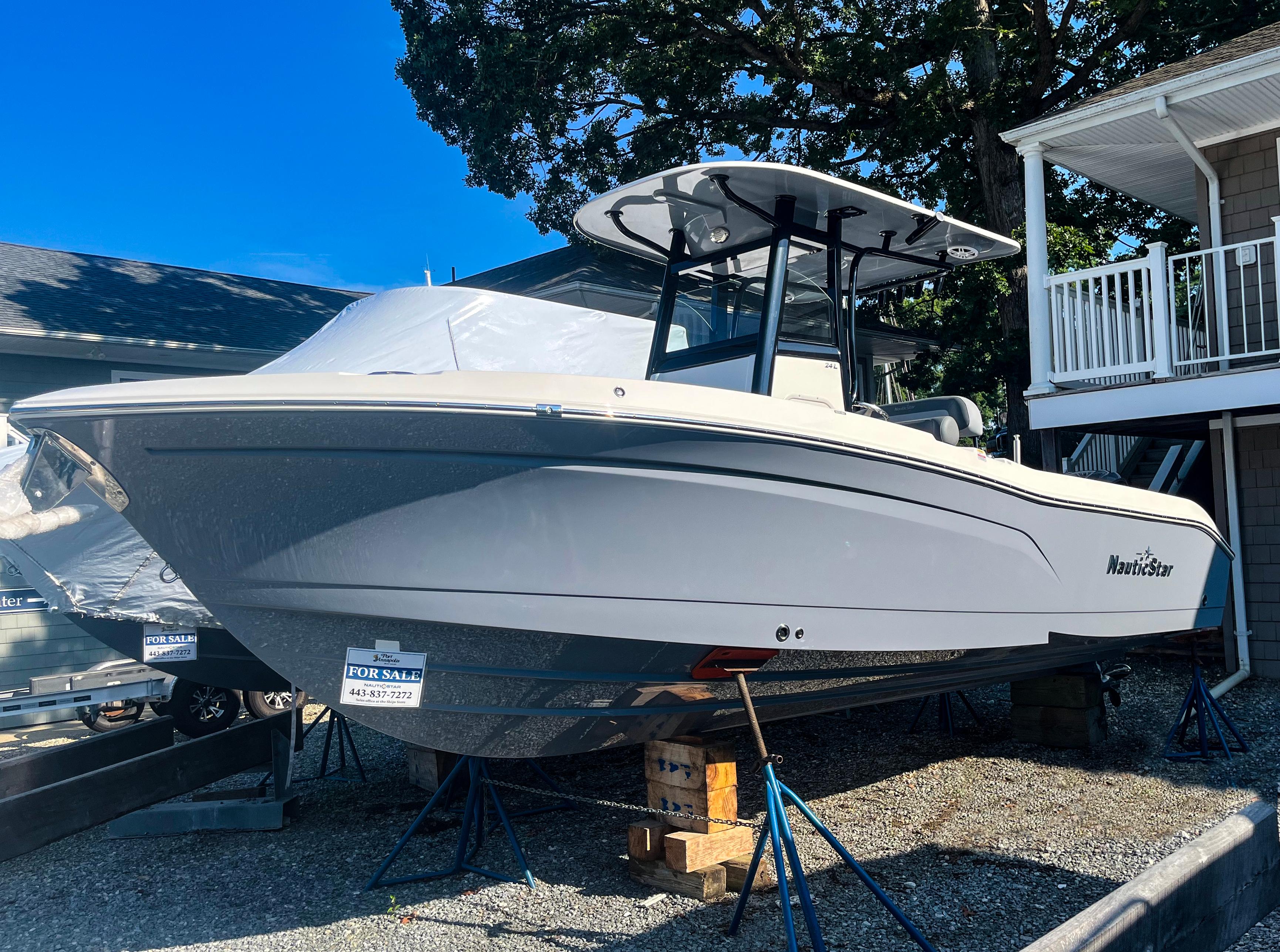NauticStar 24XS 2023 NauticStar 24XS boat for sale, displayed outdoors on stands.