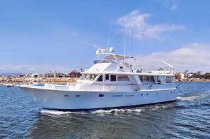 Hatteras Extended Deck Motoryacht 1981 Hatteras Extended Deckhouse yacht cruising on open water.
