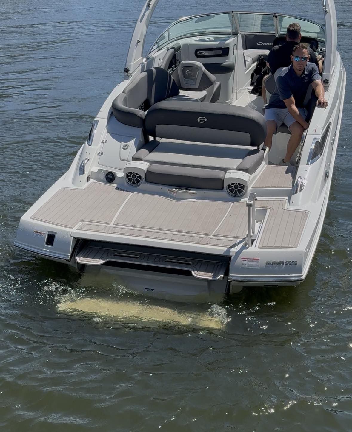 Crownline 278 SS 2026 Crownline 278 SS boat on water, rear view with passengers.