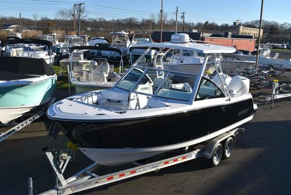 Blackfin 252DC 2024 Blackfin 252DC boat on trailer in marina setting.