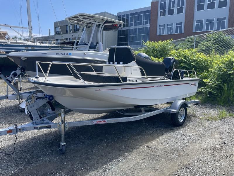 Boston Whaler 150 Montauk 2024 Boston Whaler 150 Montauk boat on trailer, parked outdoors near buildings.