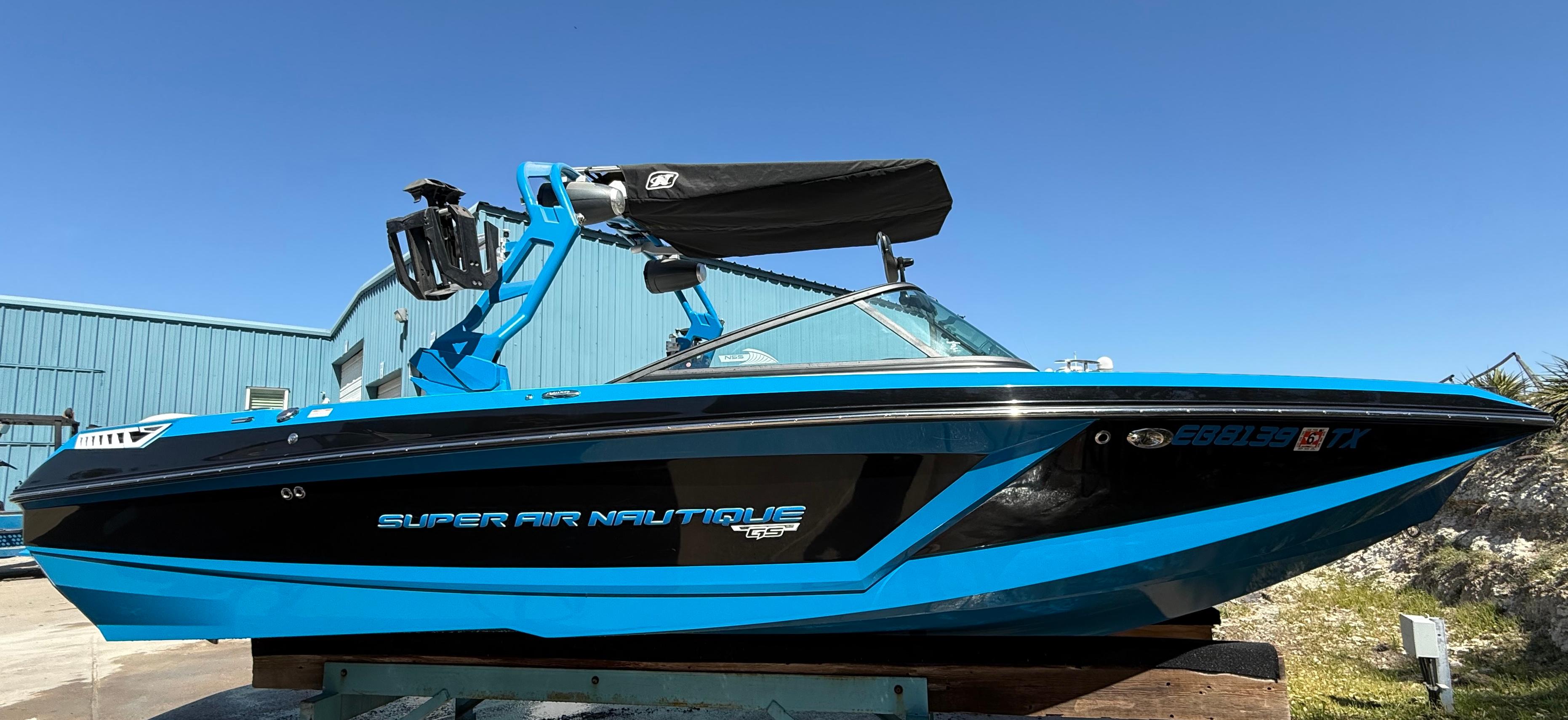 Nautique Super Air Nautique GS22 2018 Nautique Super Air Nautique GS22 boat in vibrant blue, parked outdoors.