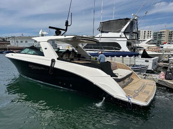 Sea Ray SLX 400 2018 Sea Ray SLX 400 luxury boat docked at marina.