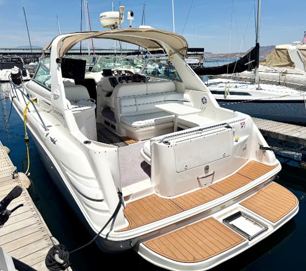 Sea Ray 330 Sundancer 1998 Sea Ray 330 Sundancer yacht docked at marina, featuring spacious seating and sleek design.