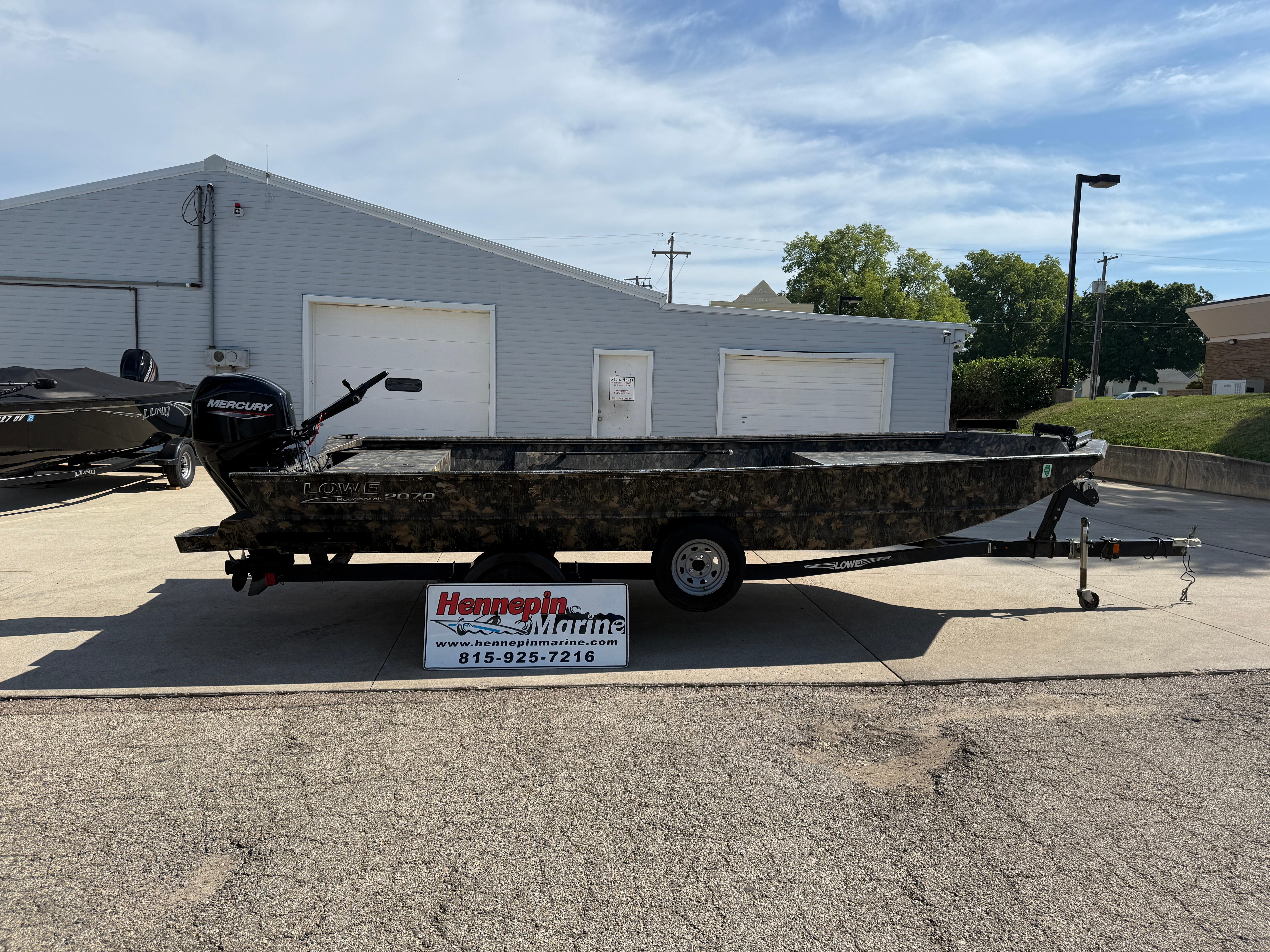 Lowe Roughneck RX2070 Tiller 2022 Lowe Roughneck RX2070 Tiller boat on trailer, parked outside Hennepin Marine.