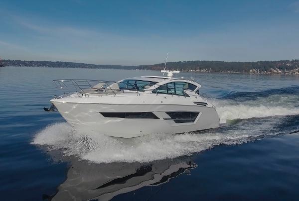 Cruisers Yachts 46 Cantius 2025 Cruisers Yachts 46 Cantius cruising on a calm lake under clear skies.