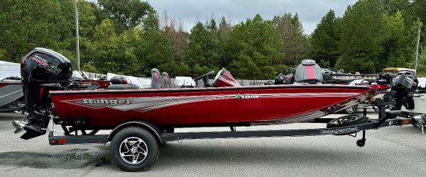 Ranger RT188P 2024 Ranger RT188P fishing boat, red, on trailer, parked outdoors.