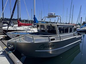 Liquid Metal Marine 22 Custom Liquid Metal 22 boat, 2002 model, docked in marina with sailboats in background.