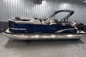 Sylvan L3 SLZ 2026 Sylvan L3 SLZ pontoon boat in showroom, featuring sleek blue design and comfortable seating.
